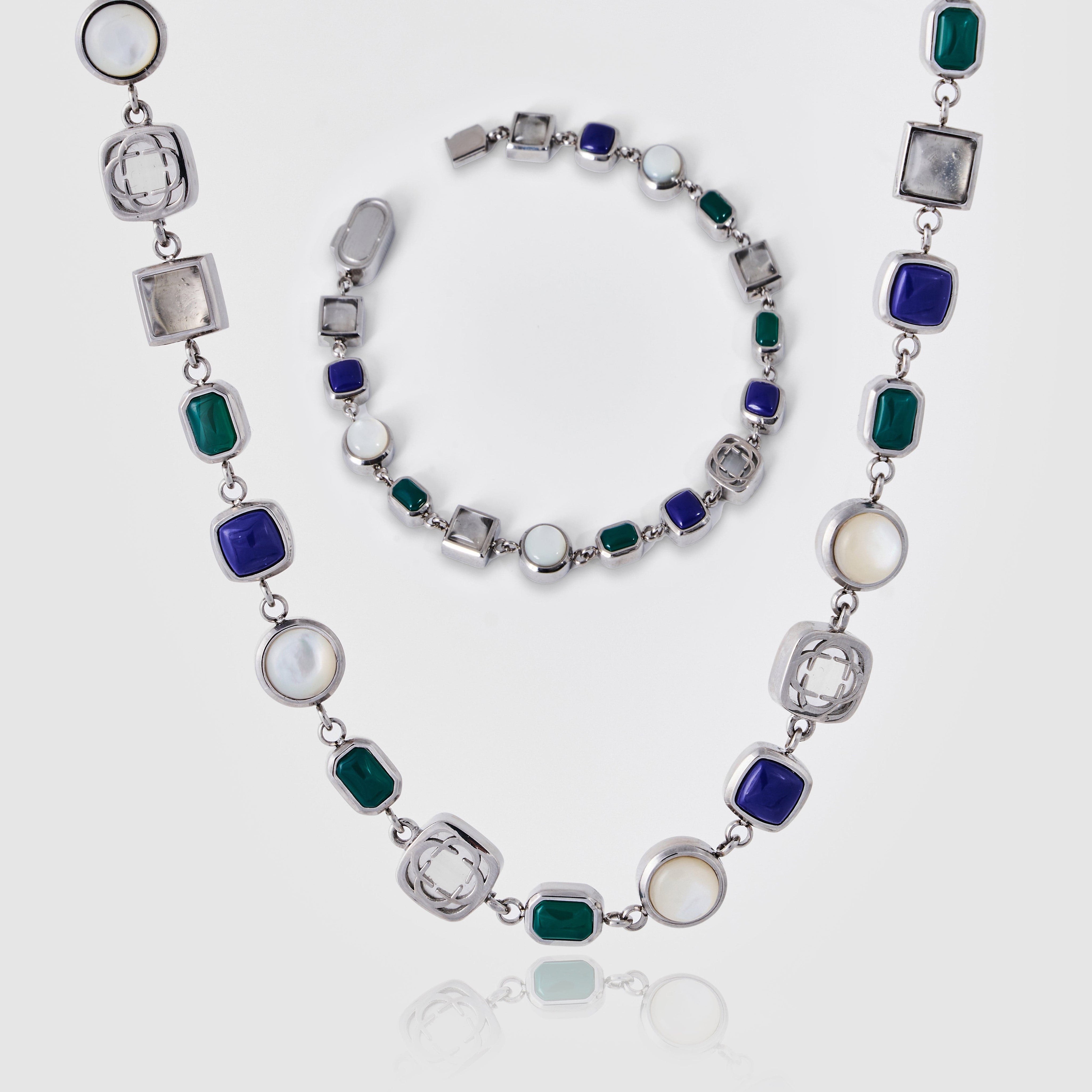 Necklace with multicolored gemstones on a white background