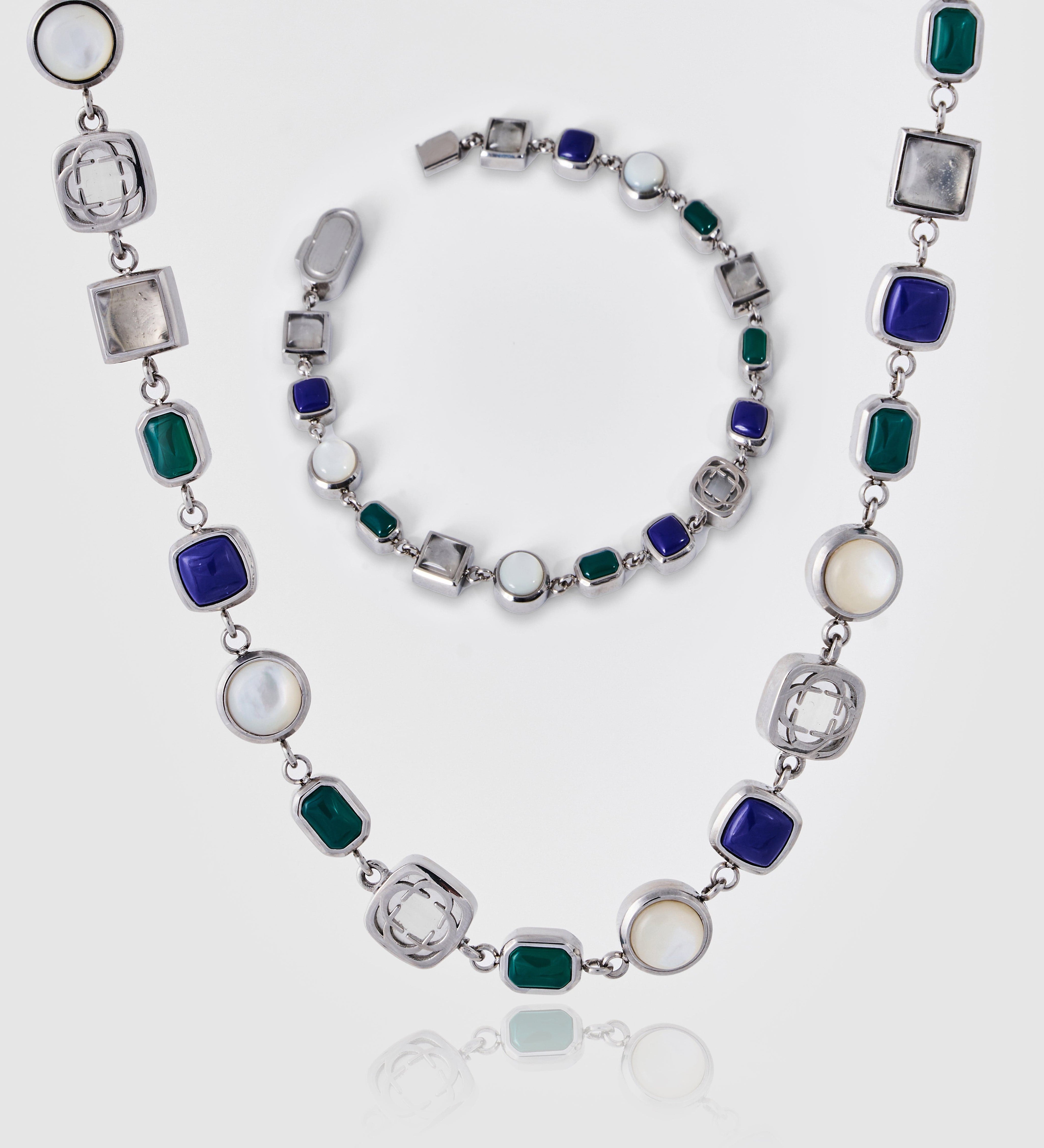 Necklace with multicolored gemstones on a white background
